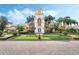 Stately community center with clock tower, beautiful landscaping, and a welcoming entrance at 11763 Eagle Ray Ln, Orlando, FL 32827