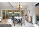 Well lit dining room with large windows that provide views of the lanai and the pool at 11763 Eagle Ray Ln, Orlando, FL 32827