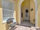 Charming front porch with a decorative door, a bench with a decorative pillow, and tiled flooring at 11763 Eagle Ray Ln, Orlando, FL 32827