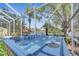 Inviting hot tub in screened patio with beautiful lake views, perfect for relaxing and unwinding at 11763 Eagle Ray Ln, Orlando, FL 32827