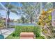 Screened hot tub with scenic lake views and tropical foliage for the ultimate relaxation and privacy at 11763 Eagle Ray Ln, Orlando, FL 32827