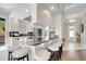 The kitchen features granite countertops with white cabinets and stainless steel appliances, and a breakfast bar for entertaining at 11763 Eagle Ray Ln, Orlando, FL 32827