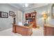 Home office with hard wood desk, custom cabinets, neutral paint and trim at 11763 Eagle Ray Ln, Orlando, FL 32827