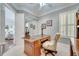 Home office featuring a hard wood desk, neutral paint, and shuttered window at 11763 Eagle Ray Ln, Orlando, FL 32827