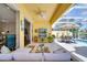 Spacious outdoor living area with pool views, comfortable seating, and seamless indoor-outdoor flow at 11763 Eagle Ray Ln, Orlando, FL 32827