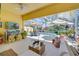 Inviting screened lanai featuring a pool, outdoor seating, and entertainment area for relaxation and enjoyment at 11763 Eagle Ray Ln, Orlando, FL 32827