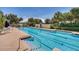 Beautiful community pool with a large number of lanes and lush landscaping at 11763 Eagle Ray Ln, Orlando, FL 32827