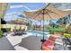Inviting backyard pool area with ample seating, perfect for enjoying the Florida sunshine and outdoor relaxation at 11763 Eagle Ray Ln, Orlando, FL 32827