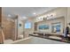 Bathroom with double sink vanity, granite countertop, tub, shower, and neutral-toned walls at 1304 Deer Run Dr, Winter Springs, FL 32708