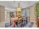 Traditional dining room featuring a wooden table with seating for six and stylish decor at 1304 Deer Run Dr, Winter Springs, FL 32708