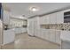 Spacious kitchen featuring sleek white cabinetry and modern appliances at 1304 Deer Run Dr, Winter Springs, FL 32708