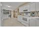 Well-lit kitchen with white appliances, island, and decorative backsplash at 1304 Deer Run Dr, Winter Springs, FL 32708