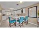 Bright, open kitchen with white cabinets, an island and modern appliances at 1304 Deer Run Dr, Winter Springs, FL 32708