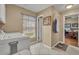 This laundry room has tile flooring, a large window, washer, and dryer at 1304 Deer Run Dr, Winter Springs, FL 32708