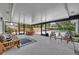 Covered patio featuring a seating area and views of the outdoor pool at 1304 Deer Run Dr, Winter Springs, FL 32708