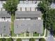 Drone shot showcasing the property's roof, backyard patios and surrounding community at 14242 Avenue Of The Groves, Winter Garden, FL 34787