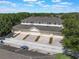 Charming aerial view highlights townhome garages with brick-paver driveways and a desirable community at 14242 Avenue Of The Groves, Winter Garden, FL 34787