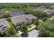 Wonderful aerial view of townhomes surrounded by nature showcasing the community's charm and convenient parking at 14242 Avenue Of The Groves, Winter Garden, FL 34787
