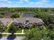 Beautiful aerial view of townhomes surrounded by lush trees and landscaping showcasing the desirable community at 14242 Avenue Of The Groves, Winter Garden, FL 34787