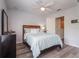 Comfortable bedroom with a wood floor and a large window at 14242 Avenue Of The Groves, Winter Garden, FL 34787