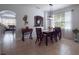 Bright dining room featuring a stylish table set and access to the kitchen at 14242 Avenue Of The Groves, Winter Garden, FL 34787