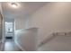 Bright hallway featuring hardwood floors and stairs leading to the second floor at 14242 Avenue Of The Groves, Winter Garden, FL 34787