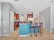 Open kitchen layout with eat-in island, stainless steel appliances, and abundant cabinet space at 14242 Avenue Of The Groves, Winter Garden, FL 34787