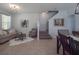 Inviting living room with a comfortable sofa, stylish decor, and neutral tones enhancing the bright, open space at 14242 Avenue Of The Groves, Winter Garden, FL 34787