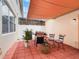 Private patio area with comfortable seating, grill and shade for outdoor enjoyment at 14242 Avenue Of The Groves, Winter Garden, FL 34787