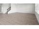 Bright living room features wood-look flooring and a staircase with decorative iron spindles at 16195 Point Rock Dr, Winter Garden, FL 34787