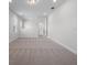 Spacious upstairs loft area with plush carpet and ample natural light from windows at 16195 Point Rock Dr, Winter Garden, FL 34787