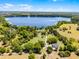 Secluded lakefront property with a long driveway, lush trees, and ample privacy at 16692 Lake Pickett Rd, Orlando, FL 32820