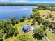 Picturesque lakefront estate with sprawling lawn and serene water views at 16692 Lake Pickett Rd, Orlando, FL 32820