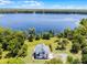 Beautiful waterfront property with mature trees and ample space for outdoor activities at 16692 Lake Pickett Rd, Orlando, FL 32820