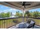 Charming balcony with stylish seating, perfect for enjoying scenic waterfront views and the fresh air at 16692 Lake Pickett Rd, Orlando, FL 32820
