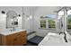 Elegant bathroom with a glass-enclosed shower, dual vanities, and modern fixtures at 16692 Lake Pickett Rd, Orlando, FL 32820