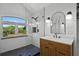 Stylish bathroom with a walk-in shower, custom vanity, and a contemporary mirror for a spa-like experience at 16692 Lake Pickett Rd, Orlando, FL 32820