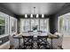 Contemporary dining room with stylish light fixture and space for hosting dinner parties at 16692 Lake Pickett Rd, Orlando, FL 32820