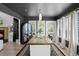Elegant dining room with stylish lighting and a rustic wood table for entertaining at 16692 Lake Pickett Rd, Orlando, FL 32820