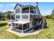 Stunning lakefront home with multiple balconies, screened lanai, pool, and spacious yard at 16692 Lake Pickett Rd, Orlando, FL 32820