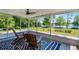 Enjoy lake views from this screened lanai with tile floors and ceiling fan at 16692 Lake Pickett Rd, Orlando, FL 32820