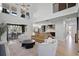 Open concept living space with view to dining and kitchen with lots of natural light at 16692 Lake Pickett Rd, Orlando, FL 32820