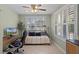 Bright office space with ample natural light from shuttered windows, with a desk and futon at 16692 Lake Pickett Rd, Orlando, FL 32820