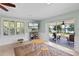 Bright room with play table, exterior view, and access to screened lanai at 16692 Lake Pickett Rd, Orlando, FL 32820