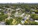 Expansive aerial shot showing the home's location amidst lush greenery and surrounding neighborhood at 1702 N Westmoreland Dr, Orlando, FL 32804