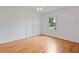 Cozy bedroom featuring hardwood floors and double door closet, offering a comfortable space at 1702 N Westmoreland Dr, Orlando, FL 32804