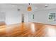 Spacious living room featuring hardwood floors, high ceilings, and large windows for natural light and bright interiors at 1702 N Westmoreland Dr, Orlando, FL 32804