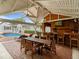 Inviting outdoor entertainment area with a fully equipped kitchen, bar, and ample seating at 1702 N Westmoreland Dr, Orlando, FL 32804