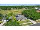 Beautiful home with solar panels and screened pool area, surrounded by lush green landscaping at 1851 Sweetwater West Cir, Apopka, FL 32712