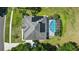 Stunning aerial view of home with solar panels and pool, showcasing its premium features and design at 1851 Sweetwater West Cir, Apopka, FL 32712